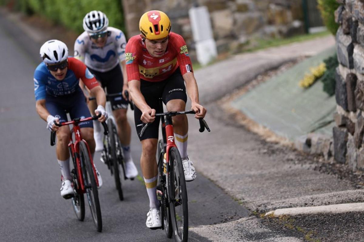 Uno-X Mobility's Danish rider Anthon Charmig leads a breakaway during the 2nd stage of the Tour Auvergne-Rhone-Alpes cycling race (formerly known as the Criterium du Dauphine), 234,3km between Saint-Martin-Le-Vinoux in the French Alps and Le Puy-en-Velay near the Massif Central, on June 8, 2026. Anne-Christine POUJOULAT / AFP