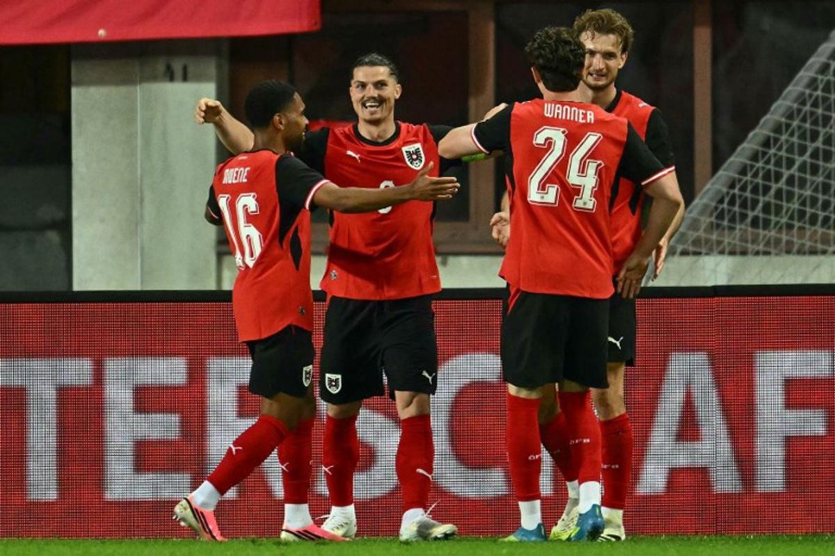 Austria's forward #09 Marcel Sabitzer (2nd L) celebrates scoring the opening goal with his teammates during the friendly football match between Austria and Tunisia in Vienna, Austria on June 1, 2026 ahead of the 2026 FIFA World Cup football tournament. Joe Klamar / AFP