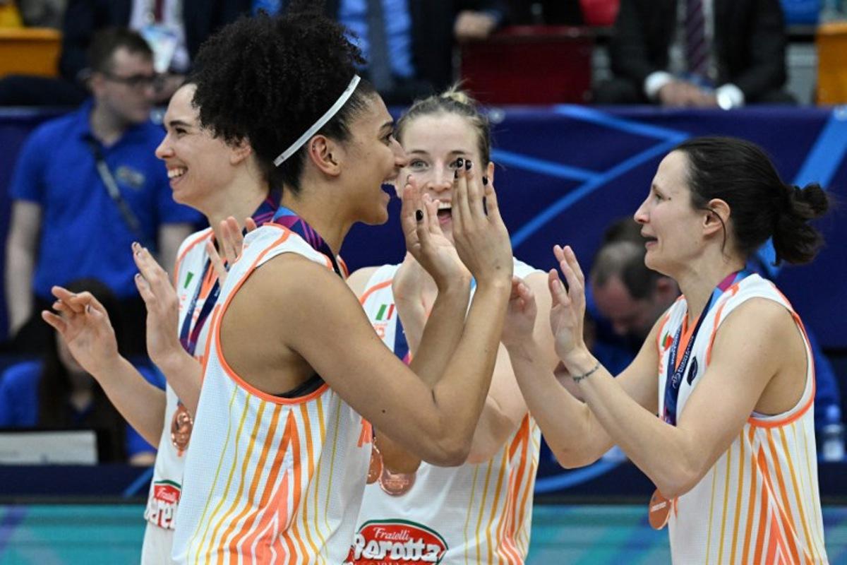 Players of Schio celebrate after defeating USK Prague in their third place match of the Euroleague Women's Final Four 2023 basketball match between USK Prague and Schio in Prague on April 16, 2023. Michal Cizek / AFP