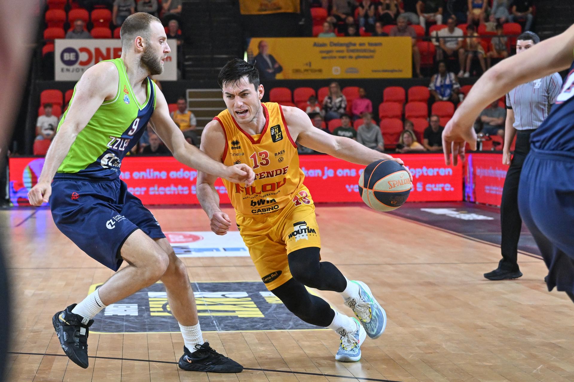 Leiden's Stan Van Den Elzen and Oostende's Alex Barcello pictured in action during a basketball match between Belgian BC Oostende and Dutch team ZZ Leiden, Friday 09 June 2023 in Oostende, the first match in the best-of-three finals of the 'BNXT League' basket championship. BELGA PHOTO DAVID CATRY