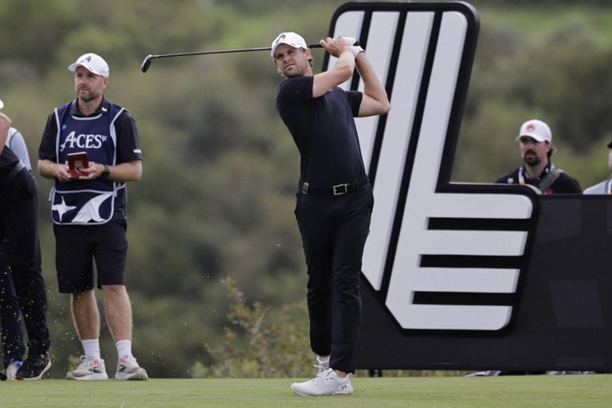 4Aces GC's Belgian player Thomas Detry watches a drive from the 14th tee on the fourth day of the LIV Golf South Africa tournament at The Club in Steyn City on March 22, 2026. WIKUS DE WET / AFP