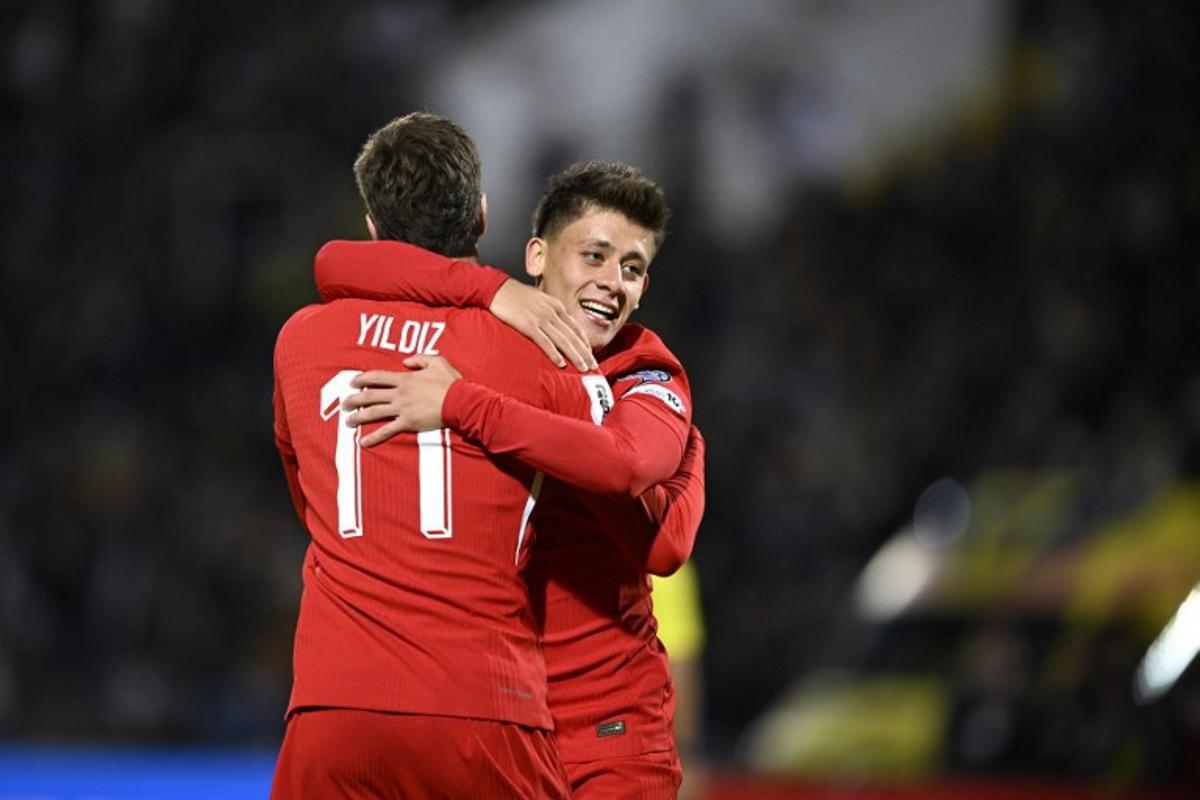 Turkey's forward #11 Kenan Yildiz (L) celebrates with Turkey's midfielder #08 Arda Guler (R) after scoring a goal during the FIFA World Cup 2026 Group E European qualification football match between Bulgaria and Turkey at the Vasil Levski National Stadium in Sofia, on October 11, 2025. Nikolay DOYCHINOV / AFP