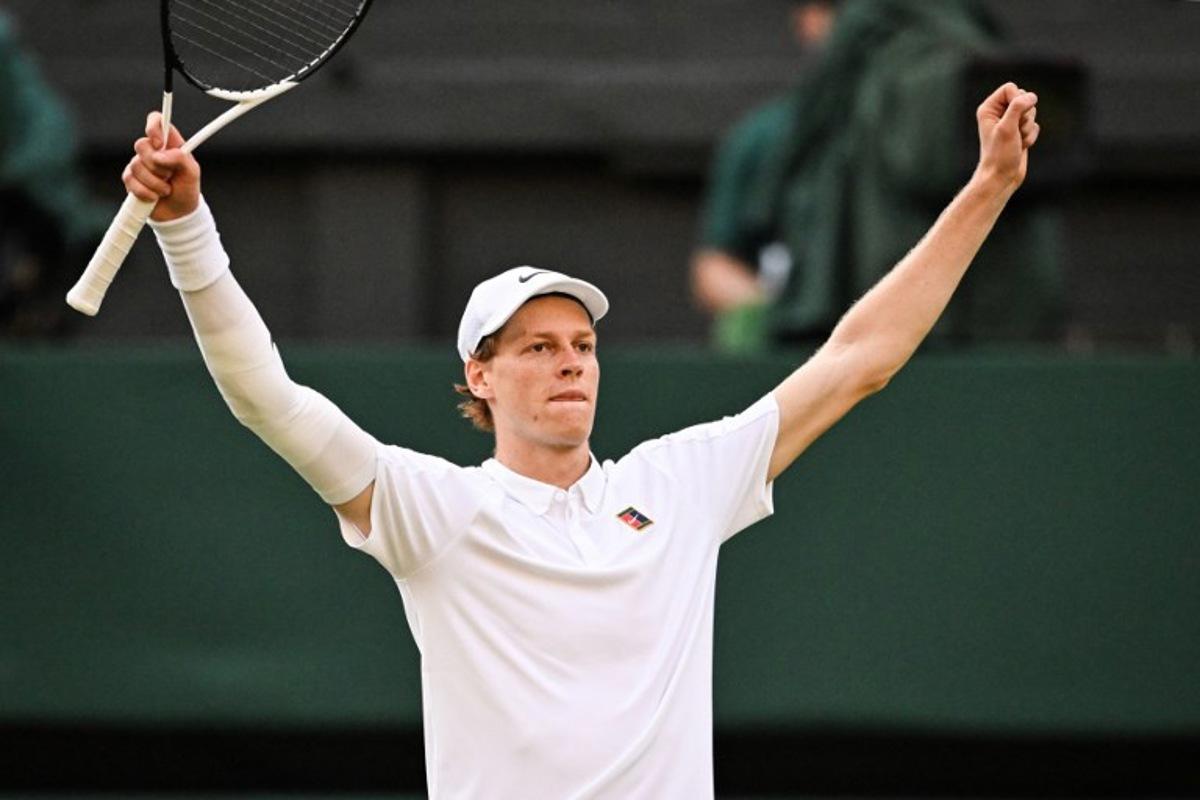 Italy's Jannik Sinner celebrates after victory against Spain's Carlos Alcaraz at the end of their men's singles final tennis match on the fourteenth day of the 2025 Wimbledon Championships at The All England Lawn Tennis and Croquet Club in Wimbledon, southwest London, on July 13, 2025. Kirill KUDRYAVTSEV / AFP