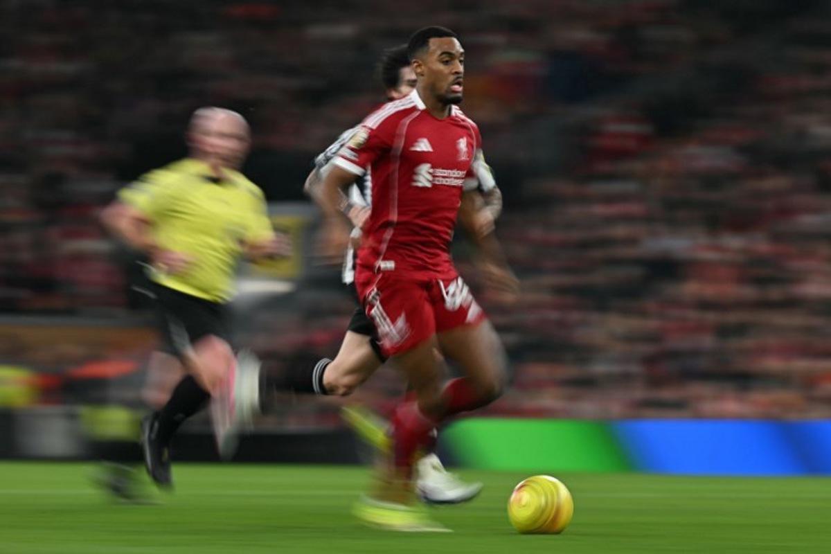 Liverpool's Dutch midfielder #38 Ryan Gravenberch runs with the ball during the English Premier League football match between Liverpool and Newcastle United at Anfield in Liverpool, north west England on January 31, 2026. Paul ELLIS / AFP