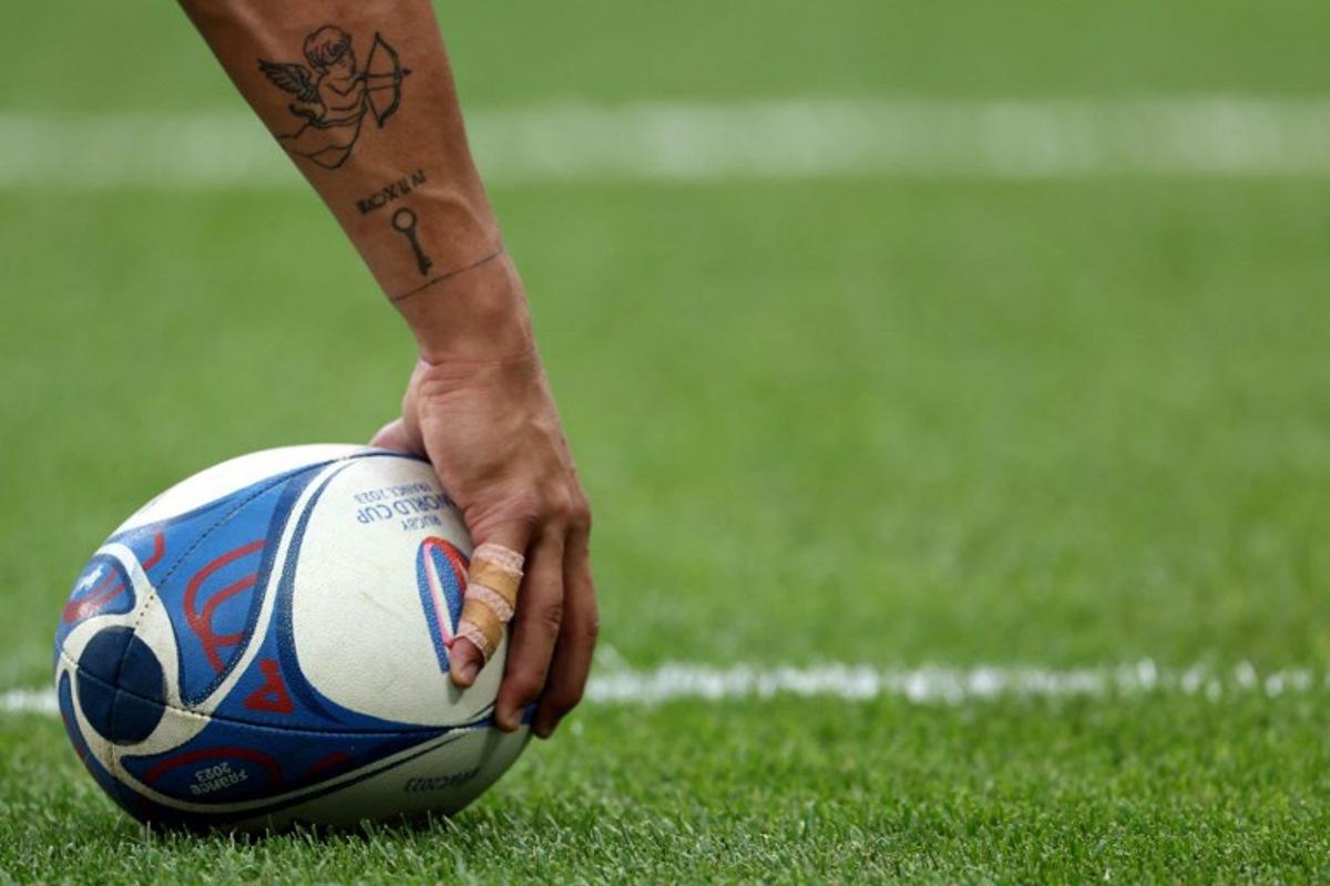 A player holds a ball prior to the France 2023 Rugby World Cup Pool C match between Australia and Georgia at Stade de France in Saint-Denis, on the outskirts of Paris, on September 9, 2023. FRANCK FIFE / AFP