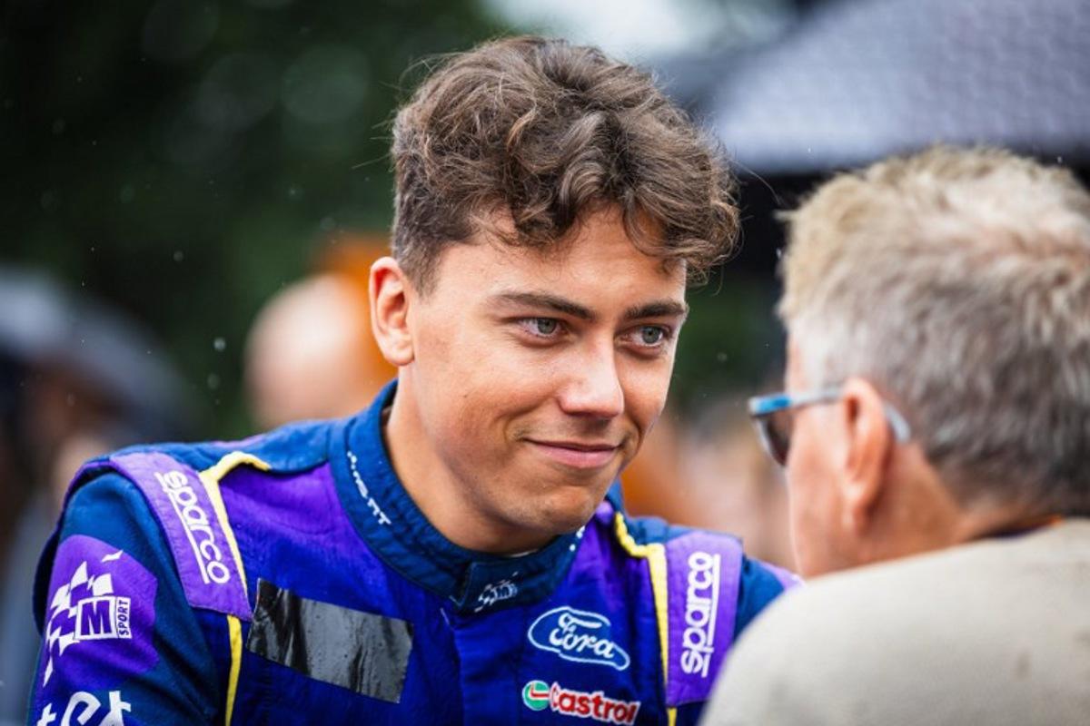Latvian driver Martins Sesks (L) gives an interview during the regroup section at the WRC Rally Finland in Jyvaskyla, Finland on August 2, 2025. Valtteri Vainio / Lehtikuva / AFP