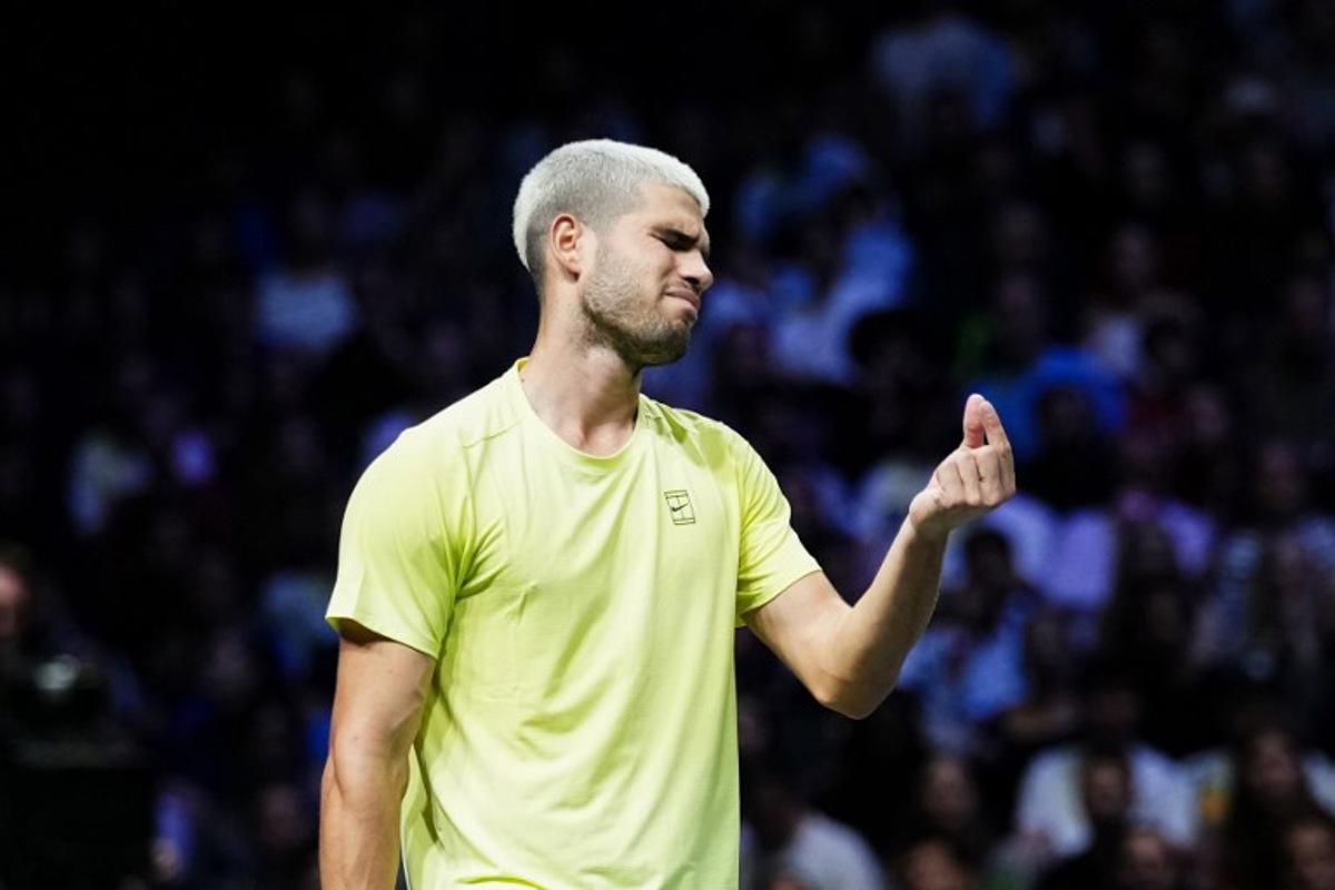 Spain's Carlos Alcaraz reacts as he plays against Britain's Cameron Norrie during their men's singles match on day two of the Paris ATP Masters 1000 tennis tournament at the Paris La Défense Arena in Nanterre, on the outskirts of Paris, on October 28, 2025. Dimitar DILKOFF / AFP