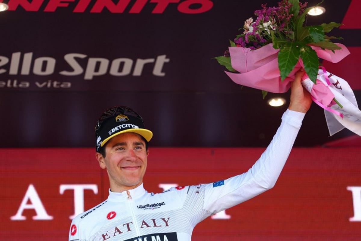 TTeam Visma-Lease a Bike's Belgian rider Cian Uijtdebroeks celebrates the best young rider's white jersey on the podium of the 9th stage of the 107th Giro d'Italia cycling race, 214km between Avezzano and Naples, on May 12, 2024. Luca Bettini / AFP