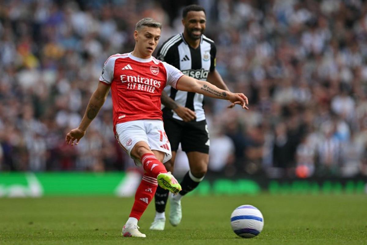 Arsenal's Belgian midfielder #19 Leandro Trossard passes the ball during the English Premier League football match between Arsenal and Newcastle United at the Emirates Stadium in London on May 18, 2025. Glyn KIRK / AFP