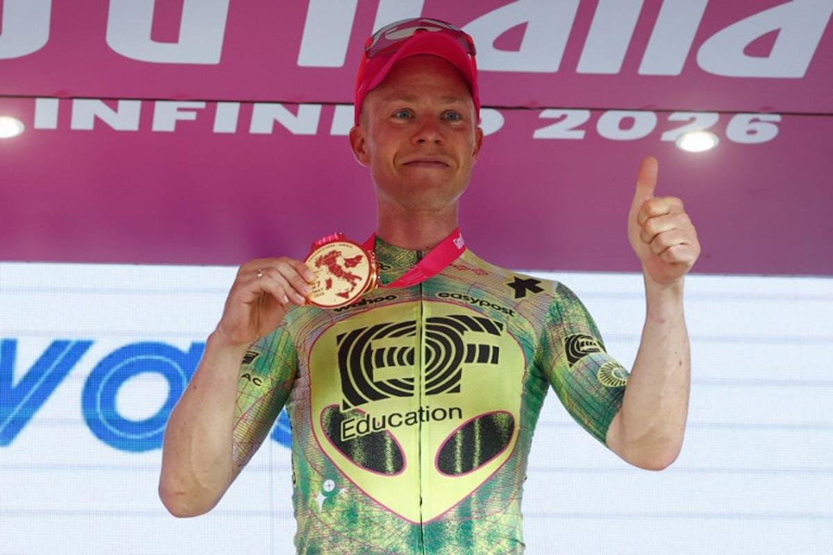 EF Education - EasyPost Danish rider Michael Valgren poses on the podium after winning the 17th stage of the Giro d'Italia 2026 - Tour of Italy cycling race between Cassano d'Adda and Andalo, Italy, on May 27, 2026. Luca Bettini / AFP